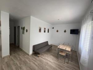 a living room with a couch and a table at Casa Nova de Bolonia in Bolonia