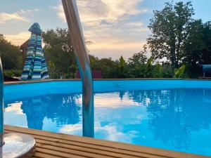 a pool with a water slide in a resort at Ruralna kuća Pejaković in Stankovac