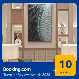 a store display with a large vase on a wall at Vida Marassi Marina Two Bedroom Hotel Apartment in El Alamein