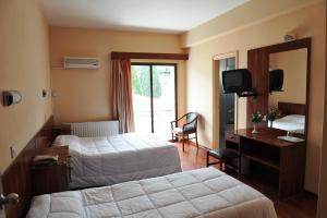 Voodi või voodid majutusasutuse Ekali Hotel toas