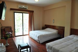 Voodi või voodid majutusasutuse Ekali Hotel toas