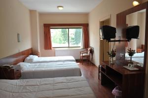 Voodi või voodid majutusasutuse Ekali Hotel toas