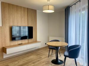 TV a/nebo společenská místnost v ubytování "Willa Octavia" Apartamenty , Pokoje