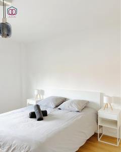 Postel nebo postele na pokoji v ubytování Élégance - Strasbourg