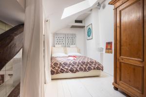 A bed or beds in a room at La Finestra