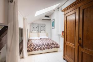 A bed or beds in a room at La Finestra