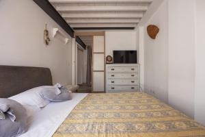 A bed or beds in a room at La Finestra