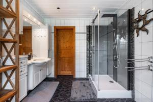 a bathroom with a shower and a tub and a sink at Zur alten Poststation in Greven +20 photos