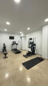 a gym with several exercise equipment in a room at Ponti Beach Hotel in Vasiliki