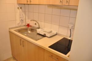 a kitchen counter with a sink and a sink at VILLA SOFIA in Nea Vrasna +167 photos