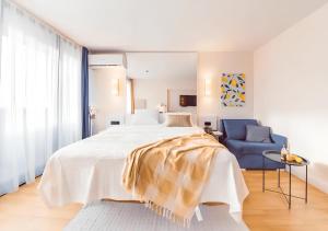 Voodi või voodid majutusasutuse Panorama Orbi City Aparthotel toas
