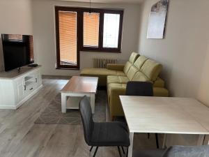 a living room with a couch and a table at Centre Trnava in Trnava