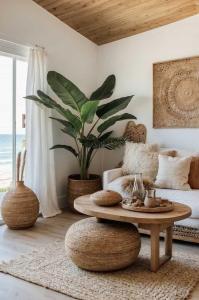 a living room with a coffee table and a plant at Amber Cruise in Luxor