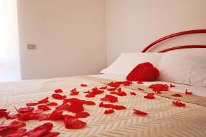 Ένα ή περισσότερα κρεβάτια σε δωμάτιο στο Le Magnolie Orchidea