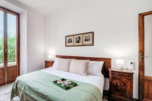 Postel nebo postele na pokoji v ubytování Villa Eugenia Suite - by MyHomeInComo
