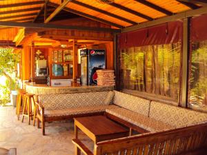 an outdoor bar with a couch and a table at Dalyan Pension in Dalyan
