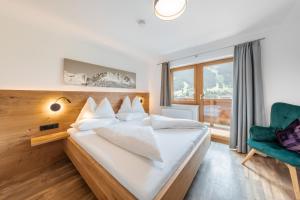 Postel nebo postele na pokoji v ubytování Appartements Retthäusl
