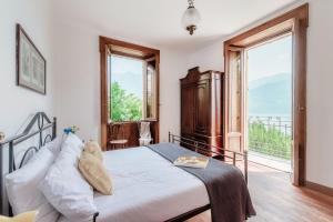 Postel nebo postele na pokoji v ubytování Villa Eugenia Suite - by MyHomeInComo