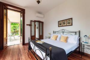 Postel nebo postele na pokoji v ubytování Villa Eugenia Suite - by MyHomeInComo