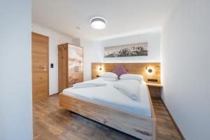 Tempat tidur dalam kamar di Appartements Retthäusl