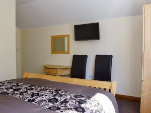 Postel nebo postele na pokoji v ubytování Copperfield Lodge