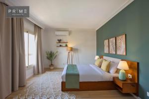 Ένα ή περισσότερα κρεβάτια σε δωμάτιο στο Prime Residence Golf Kattameya