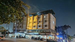 a building with a fire on top of it at Hotel My All Padang in Padang
