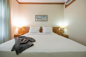 Cama ou camas em um quarto em Intercity Vinhedo