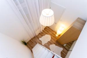 Posteľ alebo postele v izbe v ubytovaní UrbanNest