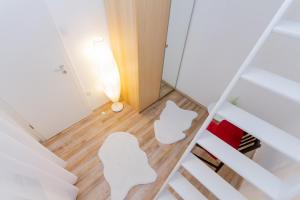 Posteľ alebo postele v izbe v ubytovaní UrbanNest