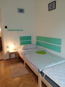 Posteľ alebo postele v izbe v ubytovaní Füsti fecske apartman