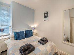 Ένα ή περισσότερα κρεβάτια σε δωμάτιο στο Littlecroft Windermere