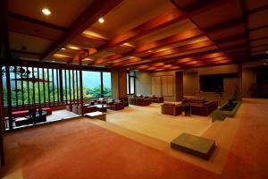 a large living room with a large window at Senkyo in Numata