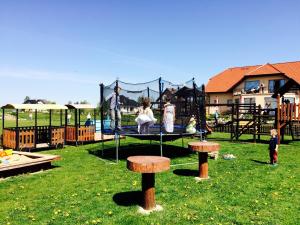 a group of people playing on a playground at Agro Nad Stawem in Żukowo