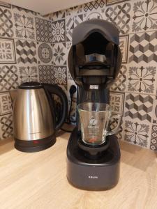 a black blender sitting on top of a table at Modern and cozy apartment in Middelkerke