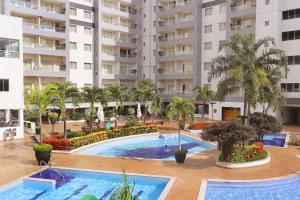 an aerial view of a large apartment complex with a swimming pool at Veredas do Rio Quente Family in Rio Quente
