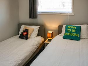 En eller flere senge i et værelse på Norfolk Nest