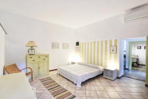 Postel nebo postele na pokoji v ubytování Casa di Charme, Rio nell'Elba