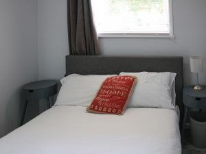 En eller flere senge i et værelse på Norfolk Nest