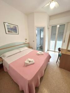 Postel nebo postele na pokoji v ubytování Hotel Caracas