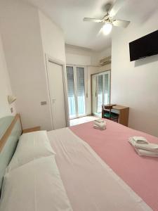 Postel nebo postele na pokoji v ubytování Hotel Caracas