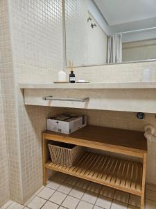 a bathroom with a sink and a mirror at Summer breeze in Puerto de Santiago