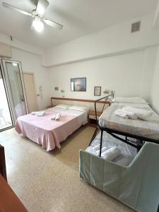 Postel nebo postele na pokoji v ubytování Hotel Caracas