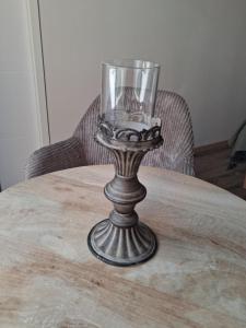 a wine glass sitting on top of a table at Villa Rosso in Clisson +4 photos