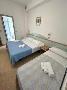 Postel nebo postele na pokoji v ubytování Hotel Caracas