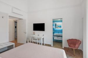 TV a/nebo společenská místnost v ubytování Lubrense Signature Suites