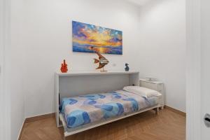 Postel nebo postele na pokoji v ubytování Lubrense Signature Suites