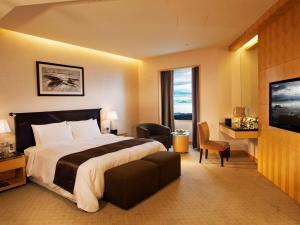 Postel nebo postele na pokoji v ubytování Resorts World Genting - Genting Grand