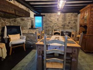 a dining room with a wooden table and chairs at Forden House in Dolgellau