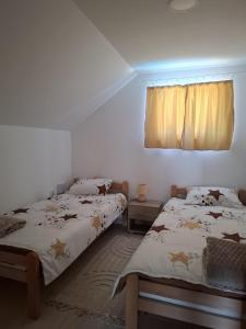 Postel nebo postele na pokoji v ubytování VIKENDICA GARAŠKI KUTAK
